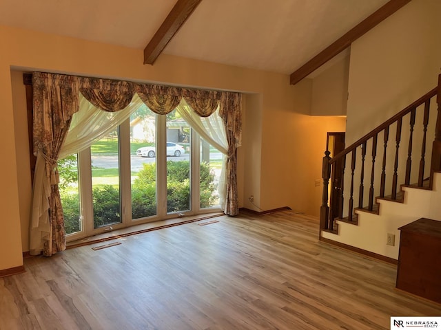 6211 S 150th St, Omaha, NE 68137 - unfurnished living room with wood finished floors and stairs