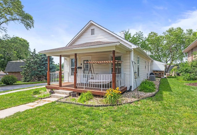 13130 N St N, Omaha, NE 68137 - view of front of home featuring a porch and a front yard