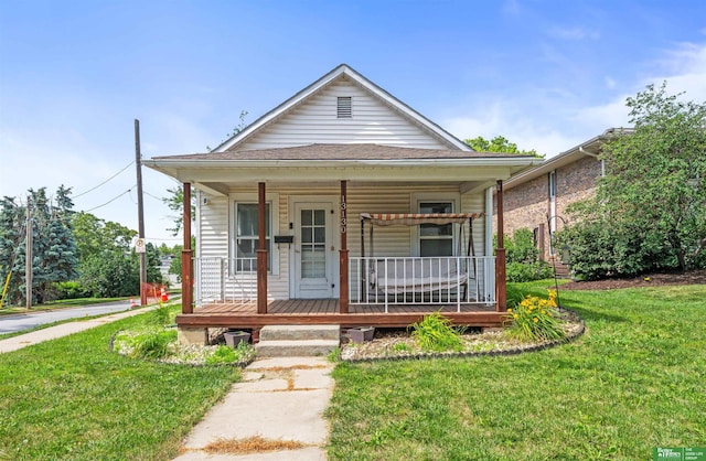13130 N St N, Omaha, NE 68137 - view of front of home with covered porch and a front lawn