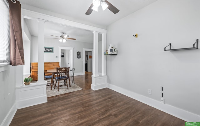 13130 N St N, Omaha, NE 68137 - dining area with ornate columns, ceiling fan, and dark wood-style flooring