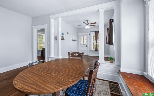13130 N St N, Omaha, NE 68137 - dining room featuring decorative columns, wood finished floors, and ceiling fan