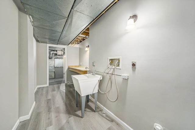 11339 Old Maple Rd, Omaha, NE 68164 - laundry room with washer hookup and wood finished floors