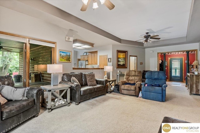 3521 N 267th Plz, Waterloo, NE 68069 - living room featuring carpet flooring, ceiling fan, and a tray ceiling
