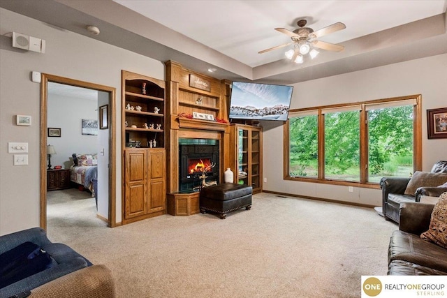 3521 N 267th Plz, Waterloo, NE 68069 - living room featuring light colored carpet, a fireplace, and ceiling fan