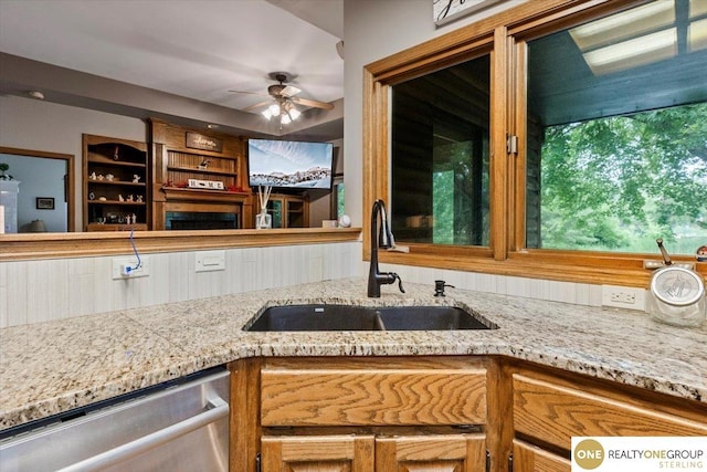3521 N 267th Plz, Waterloo, NE 68069 - kitchen with dishwasher, a ceiling fan, and light stone counters