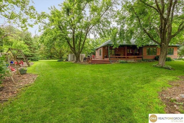 3521 N 267th Plz, Waterloo, NE 68069 - view of grassy yard featuring a wooden deck and a shed