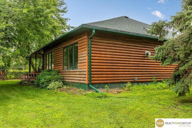 3521 N 267th Plz, Waterloo, NE 68069 - view of side of property with a shingled roof, a lawn, and faux log siding