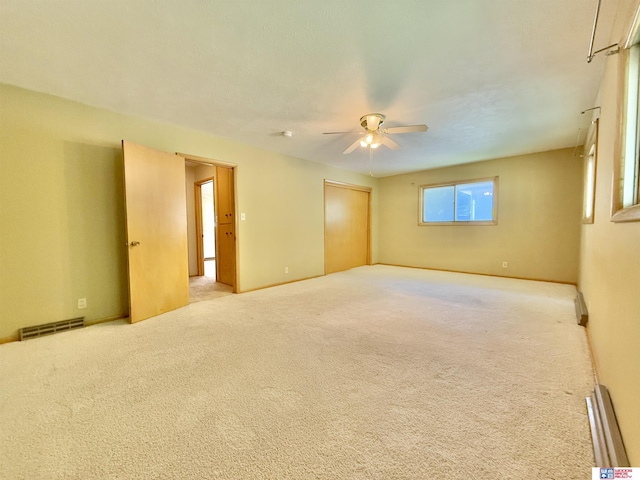 1254 N 8th St, Seward, NE 68434 - empty room with a ceiling fan and carpet flooring