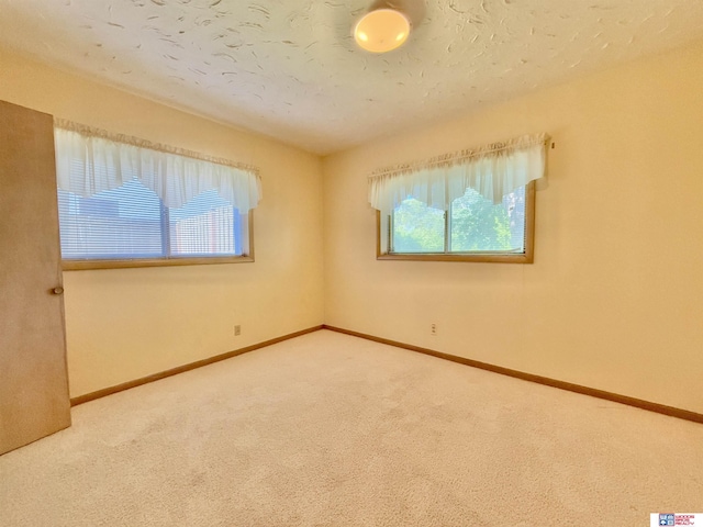 1254 N 8th St, Seward, NE 68434 - spare room featuring carpet floors and baseboards