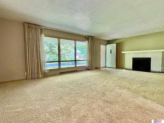 1254 N 8th St, Seward, NE 68434 - unfurnished living room featuring carpet flooring, a fireplace, and a textured ceiling