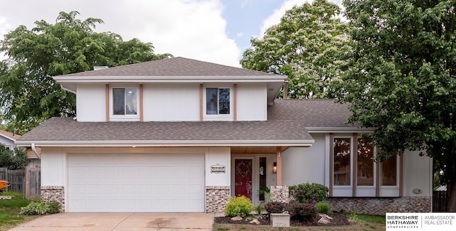 2726 N 129th Cir, Omaha, NE 68164 - view of front of property featuring an attached garage, concrete driveway, a shingled roof, and stone siding