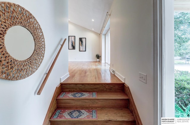 2726 N 129th Cir, Omaha, NE 68164 - stairs featuring lofted ceiling, healthy amount of natural light, wood finished floors, and recessed lighting