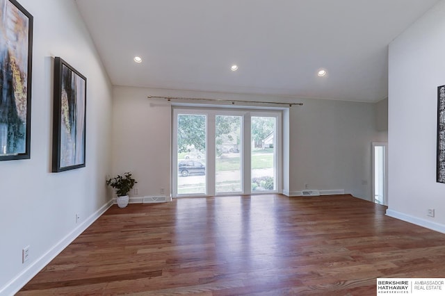 2726 N 129th Cir, Omaha, NE 68164 - spare room with wood finished floors, lofted ceiling, and recessed lighting