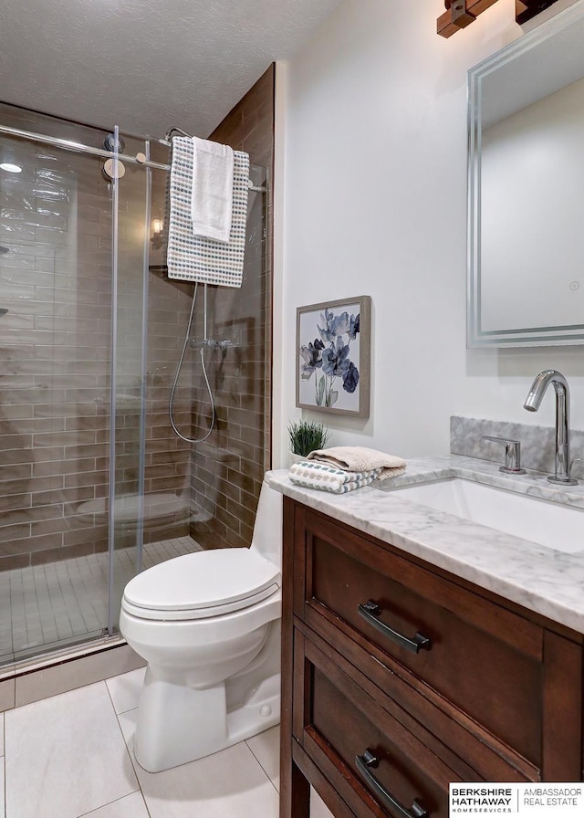 2726 N 129th Cir, Omaha, NE 68164 - full bathroom featuring vanity, a shower stall, and tile patterned floors