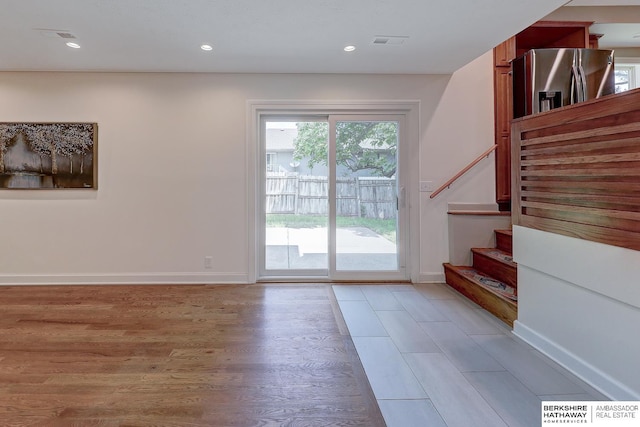 2726 N 129th Cir, Omaha, NE 68164 - doorway featuring light wood-type flooring, stairway, and recessed lighting