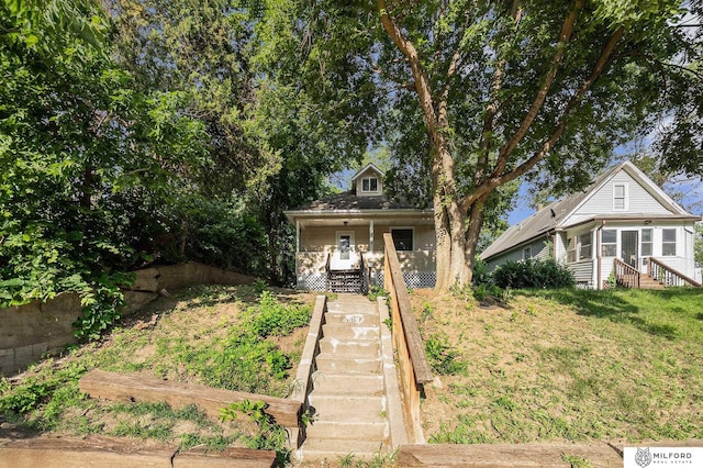 4419 N 39th St, Omaha, NE 68111 - view of front of property featuring covered porch, stairs, and a vegetable garden