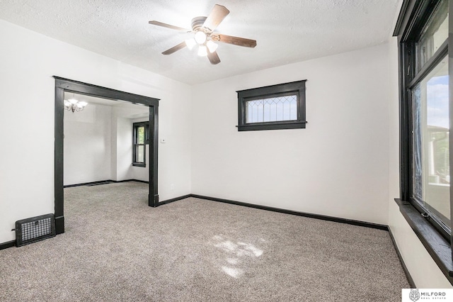 4419 N 39th St, Omaha, NE 68111 - spare room with carpet floors, ceiling fan, and a textured ceiling