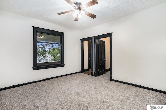 4419 N 39th St, Omaha, NE 68111 - carpeted empty room with ceiling fan and a textured ceiling