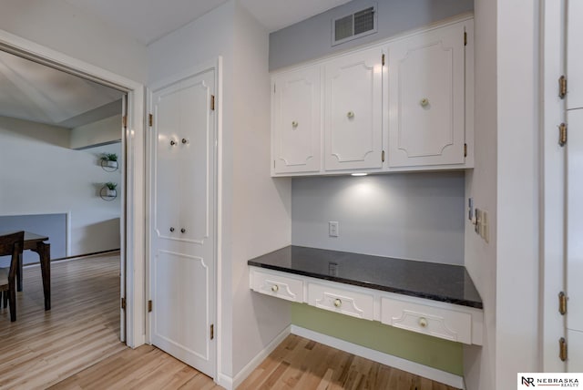 1373 S 137th Ave, Omaha, NE 68144 - kitchen featuring light wood-type flooring and white cabinets