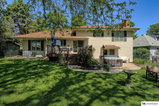 1373 S 137th Ave, Omaha, NE 68144 - rear view of property with a deck, a chimney, a hot tub, and a fenced backyard
