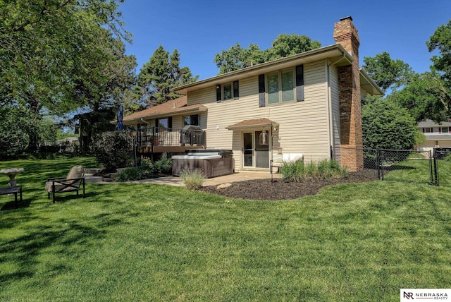 1373 S 137th Ave, Omaha, NE 68144 - rear view of property featuring a hot tub, a chimney, and a deck
