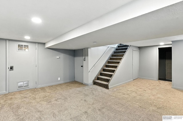 3080 S 48th St, Omaha, NE 68106 - finished below grade area featuring carpet floors, recessed lighting, and stairway