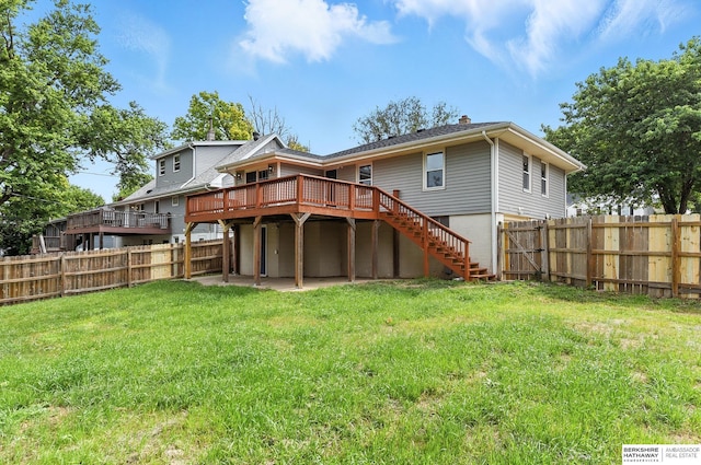 3080 S 48th St, Omaha, NE 68106 - back of property with a wooden deck, a fenced backyard, and stairs