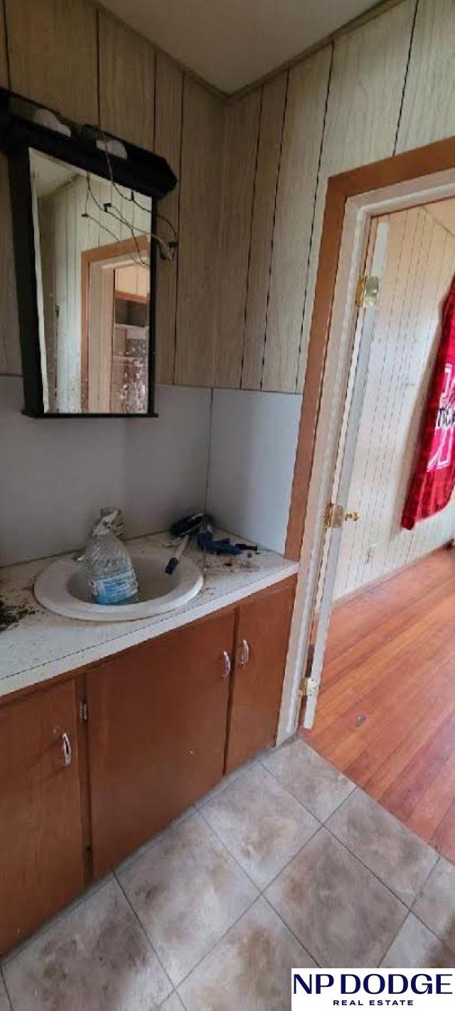 609 Howard St, Scribner, NE 68057 - bathroom with vanity and tile patterned flooring