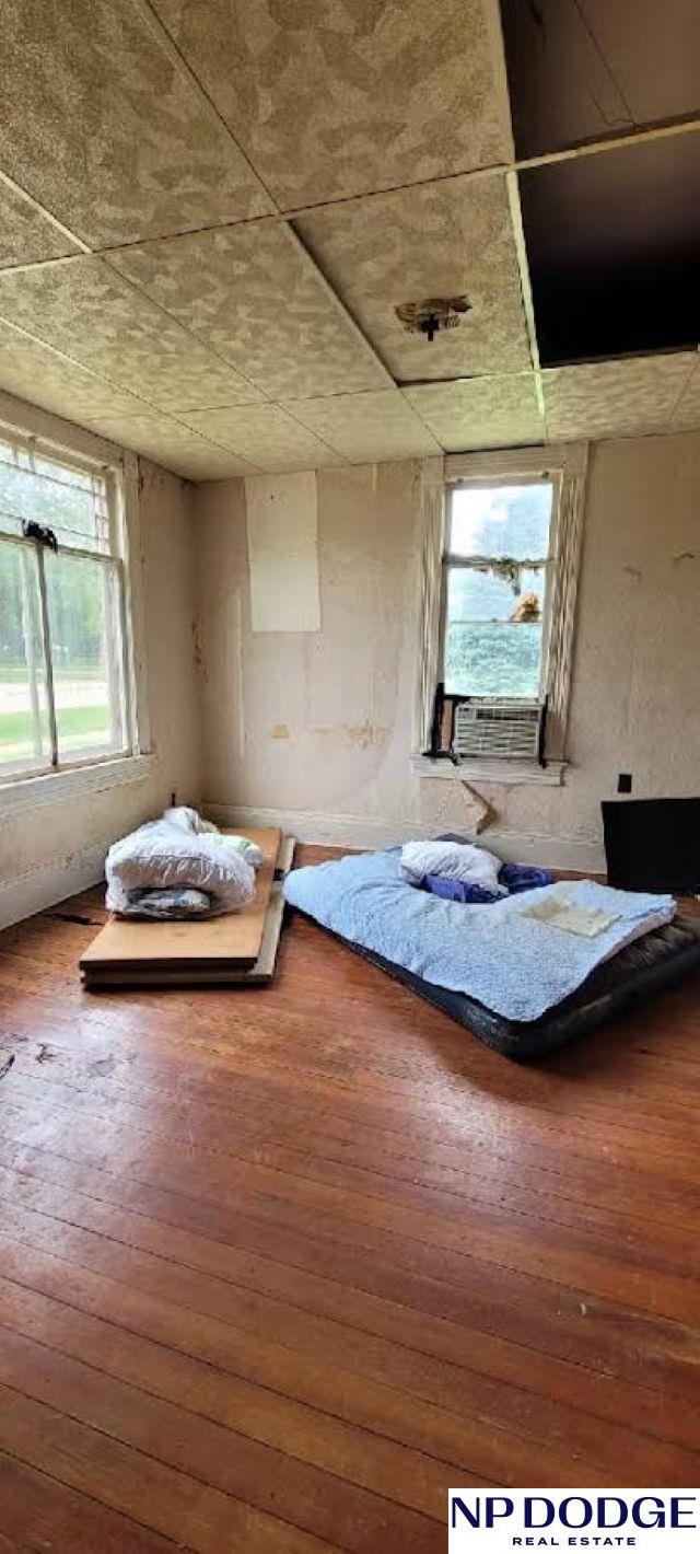 609 Howard St, Scribner, NE 68057 - bedroom featuring hardwood / wood-style floors and cooling unit