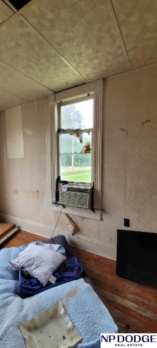 609 Howard St, Scribner, NE 68057 - detailed view of wood finished floors and cooling unit