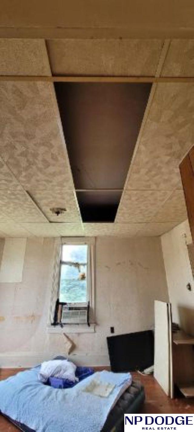 609 Howard St, Scribner, NE 68057 - bedroom with cooling unit and a paneled ceiling