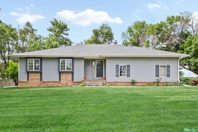 411 Hillside Ave, Yutan, NE 68073 - ranch-style home with a front lawn, brick siding, and a shingled roof