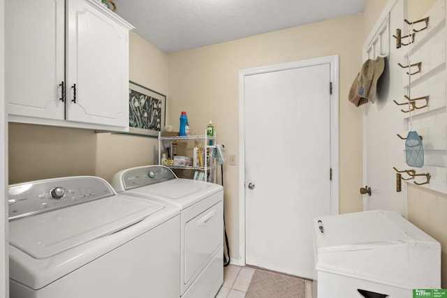 411 Hillside Ave, Yutan, NE 68073 - washroom featuring separate washer and dryer, cabinet space, and light tile patterned floors