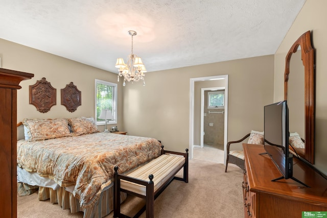 411 Hillside Ave, Yutan, NE 68073 - bedroom with light carpet, a chandelier, and a textured ceiling