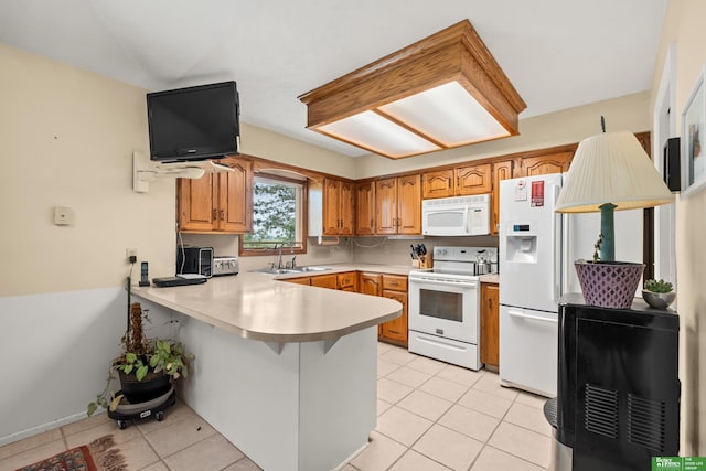 411 Hillside Ave, Yutan, NE 68073 - kitchen featuring white appliances, a peninsula, light tile patterned floors, light countertops, and brown cabinetry