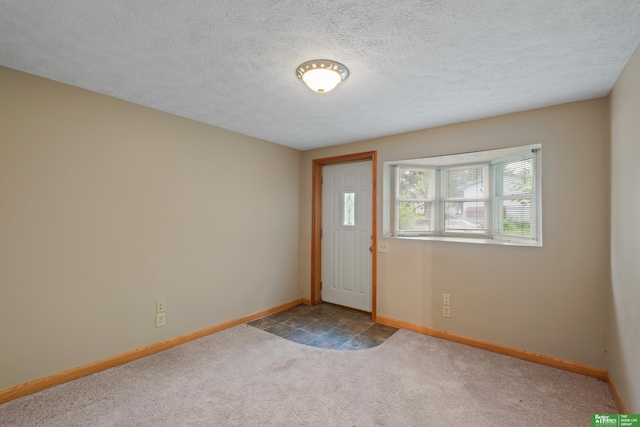 36 Redwood Ln, Yutan, NE 68073 - entryway featuring carpet and a textured ceiling