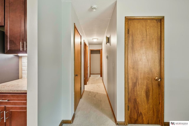 11018 Hascall St, Omaha, NE 68144 - hallway with baseboards and light colored carpet