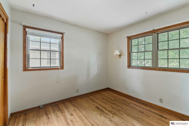 11018 Hascall St, Omaha, NE 68144 - unfurnished room featuring plenty of natural light and light wood-type flooring
