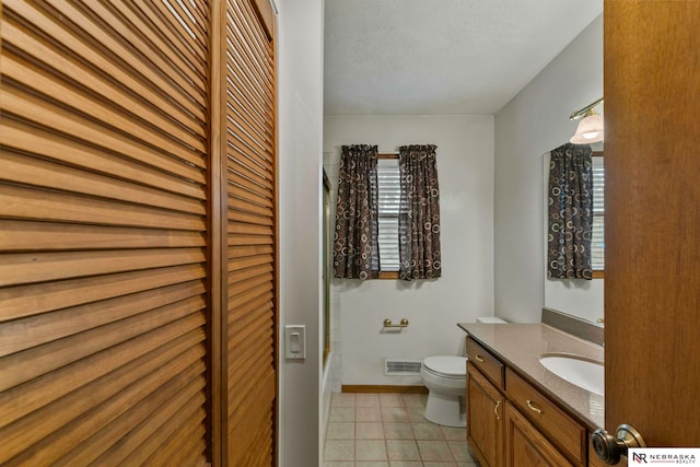 11018 Hascall St, Omaha, NE 68144 - bathroom with vanity, a closet, and tile patterned floors