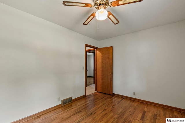 11018 Hascall St, Omaha, NE 68144 - spare room featuring wood finished floors and ceiling fan
