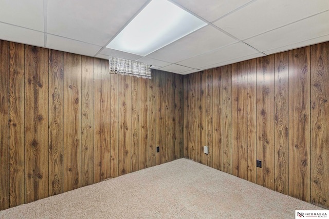 11018 Hascall St, Omaha, NE 68144 - finished basement with a drop ceiling, carpet floors, and wood walls