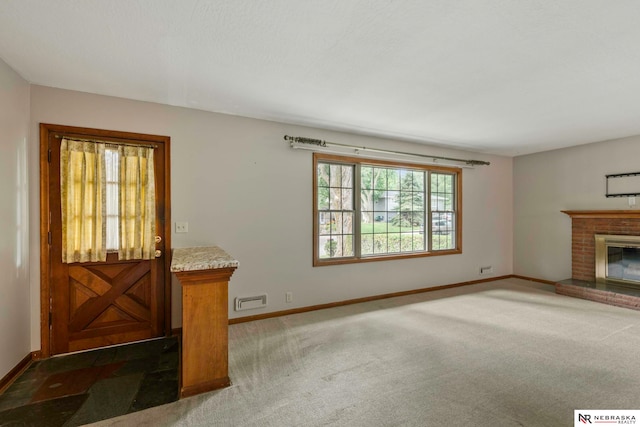 11018 Hascall St, Omaha, NE 68144 - unfurnished living room featuring carpet floors and a brick fireplace