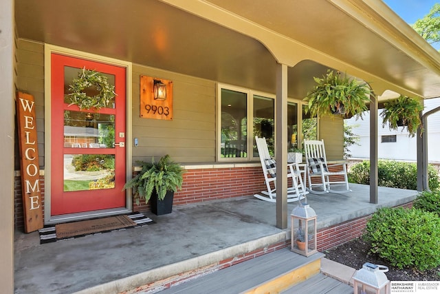 9903 Pasadena Ave, Omaha, NE 68124 - view of exterior entry featuring a porch