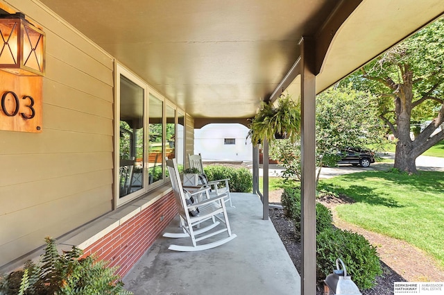9903 Pasadena Ave, Omaha, NE 68124 - porch featuring a yard