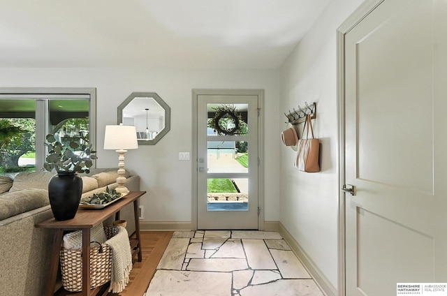 9903 Pasadena Ave, Omaha, NE 68124 - foyer entrance featuring baseboards and light wood-type flooring