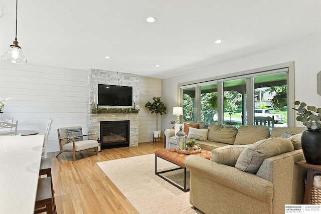 9903 Pasadena Ave, Omaha, NE 68124 - living area with light wood finished floors, a fireplace, and recessed lighting