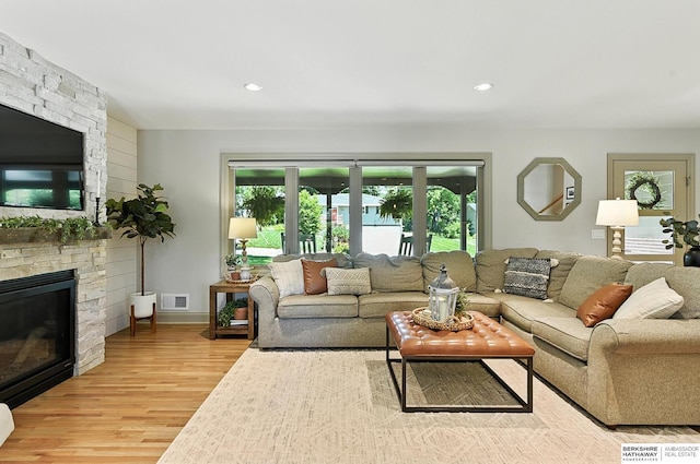 9903 Pasadena Ave, Omaha, NE 68124 - living area with a fireplace, light wood-type flooring, and recessed lighting