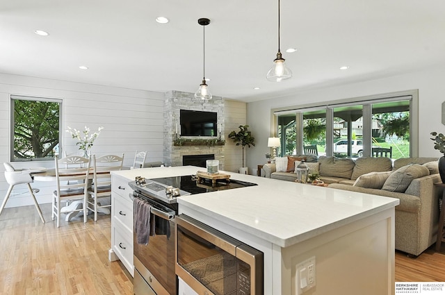 9903 Pasadena Ave, Omaha, NE 68124 - kitchen with stainless steel appliances, open floor plan, healthy amount of natural light, and recessed lighting