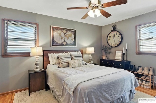 9903 Pasadena Ave, Omaha, NE 68124 - bedroom with light wood-type flooring and a ceiling fan