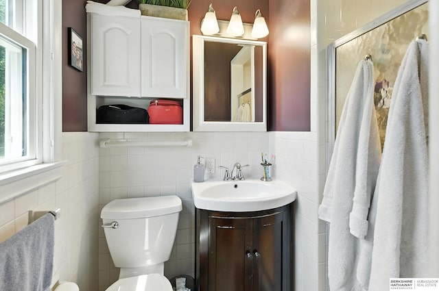 9903 Pasadena Ave, Omaha, NE 68124 - bathroom featuring tile walls and vanity